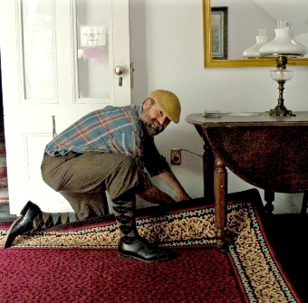 John spreading an area carpet at the Unitarian Universalist Meetnghouse in Provincetown, MA