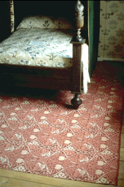 Pomegranate in carpet in William Morris house